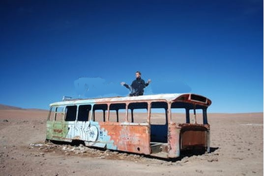 Man Meditating On A Broken Bus
