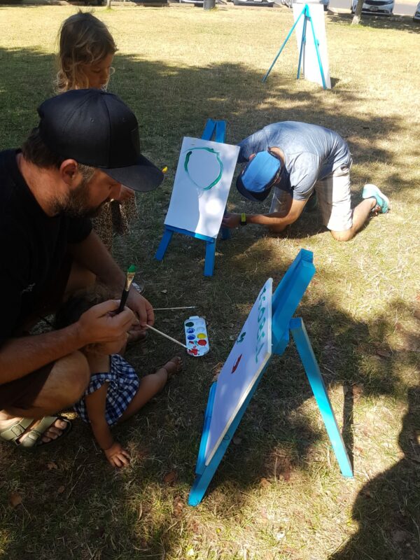 kid drawing with his father