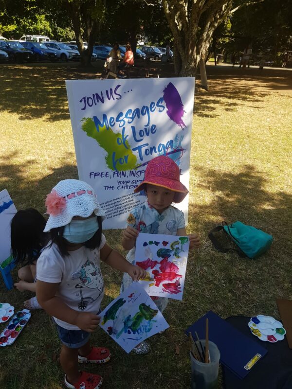 little girls showing their drawing