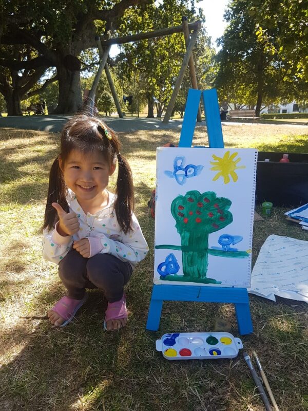 Happy girl with her drawing